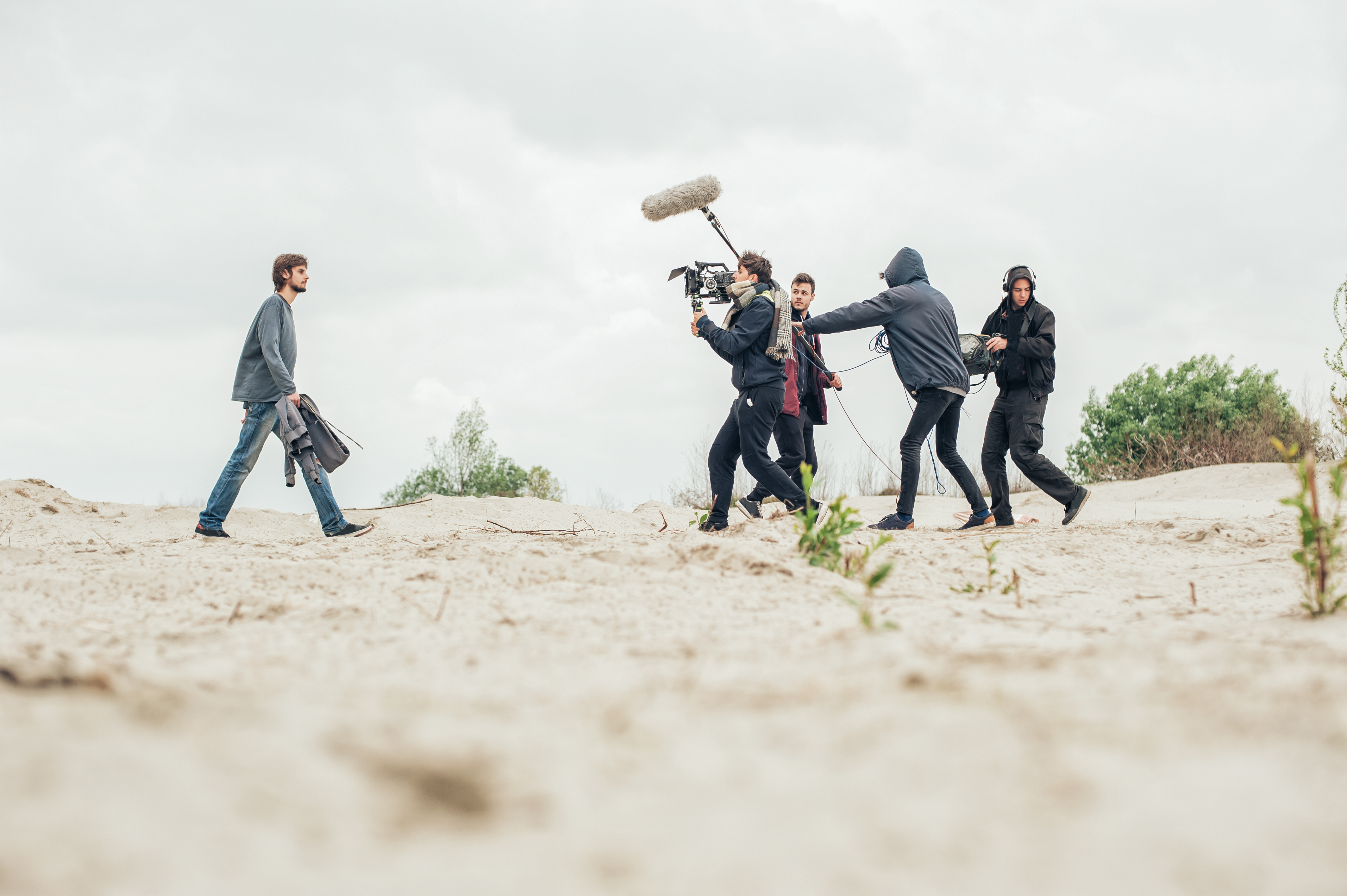 Film crew shooting on a beach